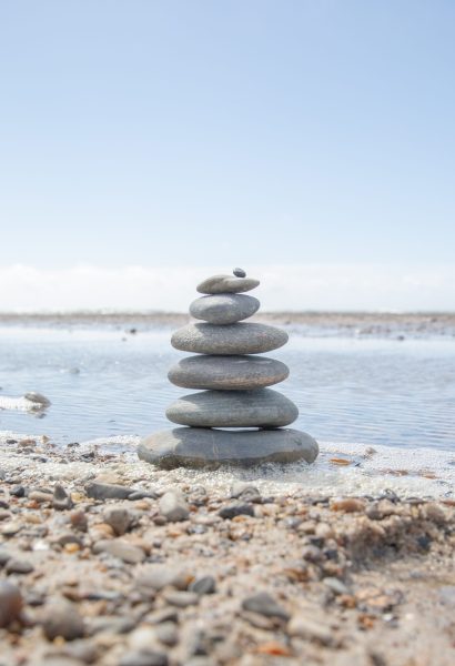 A beautiful shot of a stack of rocks on the beach - business stability concept